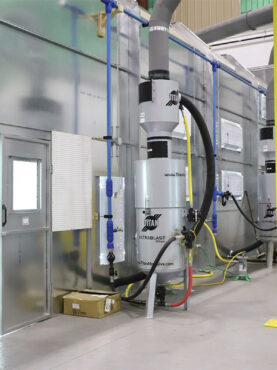 A blast room enclosure with Titan's Dual Vacuum Reclaim System.