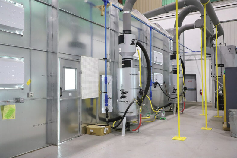 Titan blast room with custom ducting and supports; note the long radius elbows.