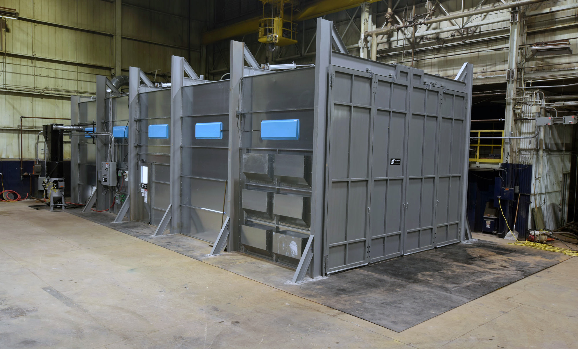 A Titan blast room with Bi-Fold doors; note the crane access center top