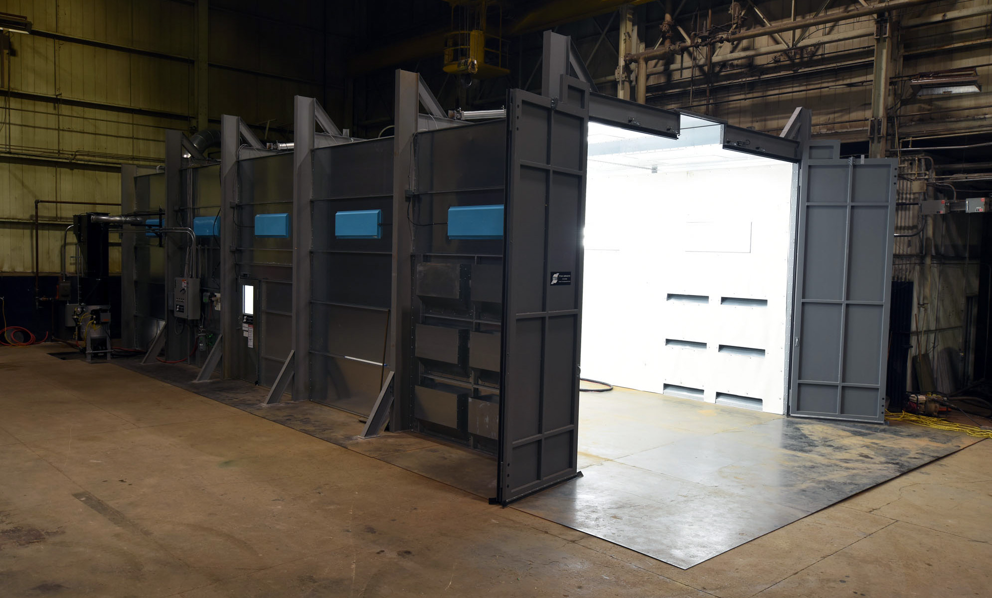 A Titan blast room with Bi-Fold doors; note the crane access center top